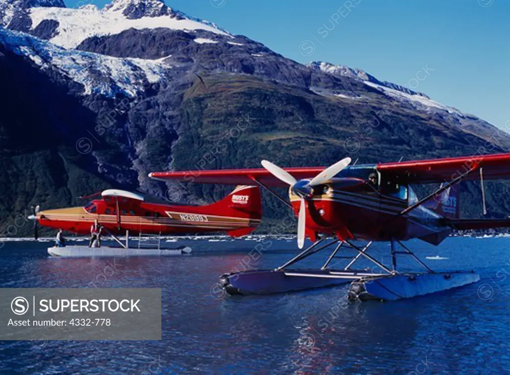 Rust's Flying Service turboprop de Havilland Otter and Cessna 206 on Harriman Fiord with Roaring Glacier beyond, Prince William Sound, Chugach Mountains, Chugach National Forest, Alaska.