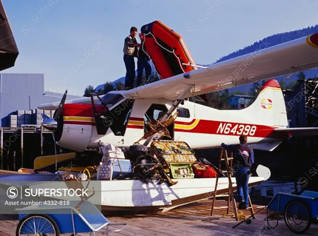 Preparing humorous external load, Bellair's de Havilland DHC2 Beaver on dock for one-hundred hour, Sitka, Alaska.