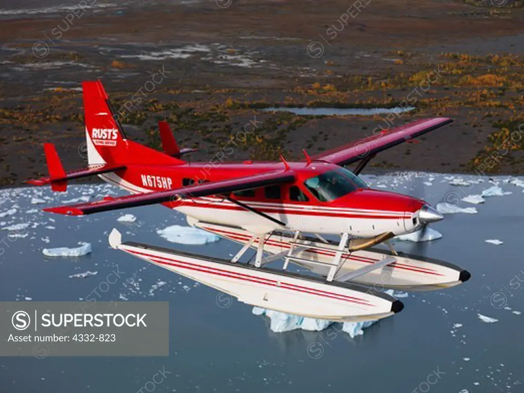 Rust's Flying Service Cessna 208 Caravan on floats flying above Lake George, Alaska.