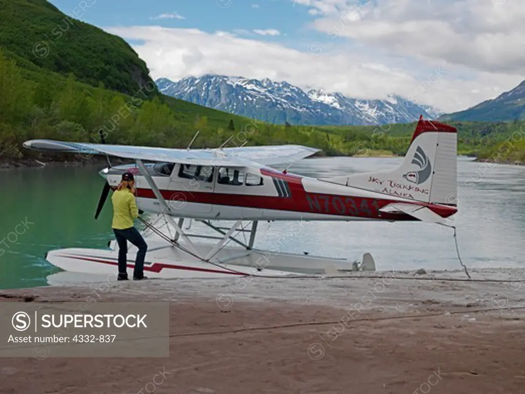 Lori Egge turning her Cessna 185 around, Chakachamna River, Alaska.