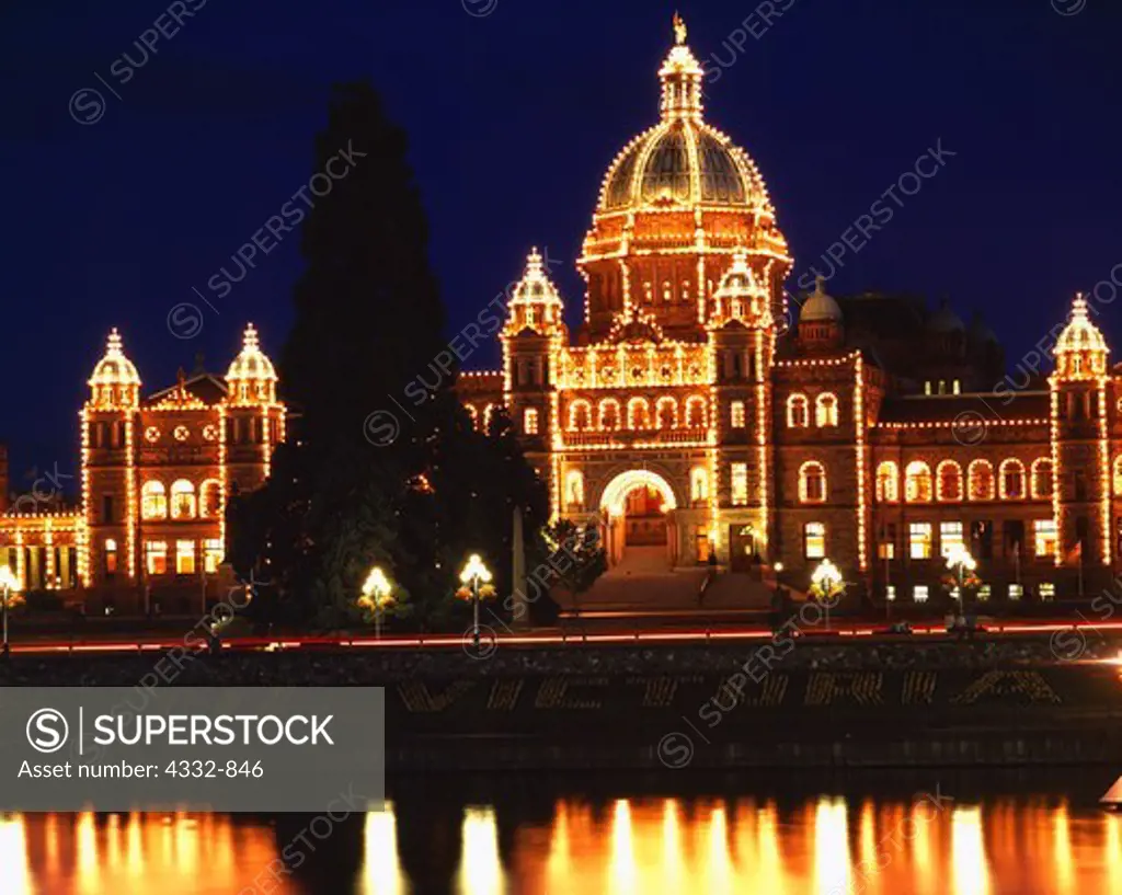 Night view of Parliament Buildings reflected in Inner harbour of Victoria Harbour, Victoria, British Columbia, Canada.