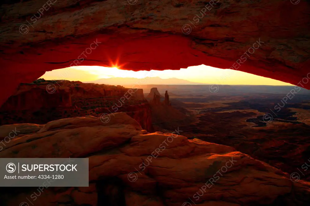 Mesa Arch and the Washerwoman at dawn, Canyonlands National Park, Utah, USA