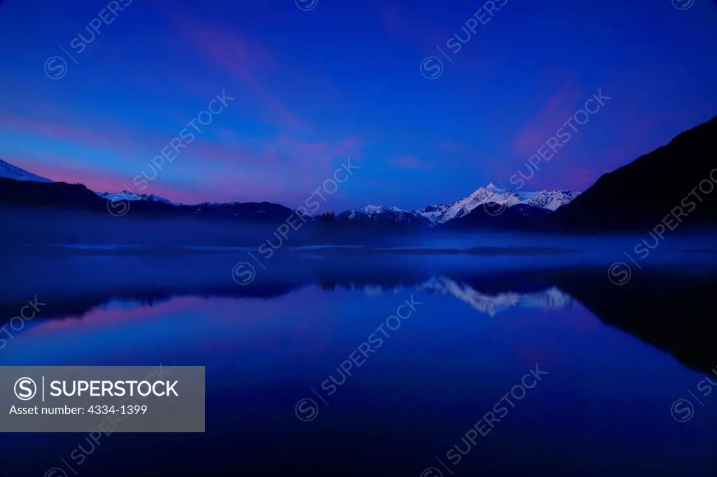 Reflection of a mountain range in a lake at dusk, Mt Shuksan, Baker Lake, Mt Baker-Snoqualmie National Forest, Washington State, USA