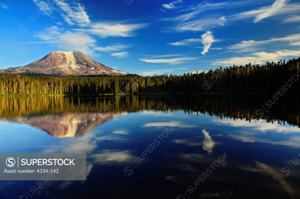 Mount Adams, a smaller Cascades volcano east of Mount Saint Helens, is reflected in nearby Takhlakh Lake, Gifford Pinchot National Forest, Washington.