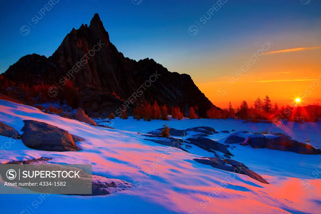Sunrise over frozen over Gnome Tarn, Prusik Peak, Alpine Lakes Wilderness, Washington State, USA