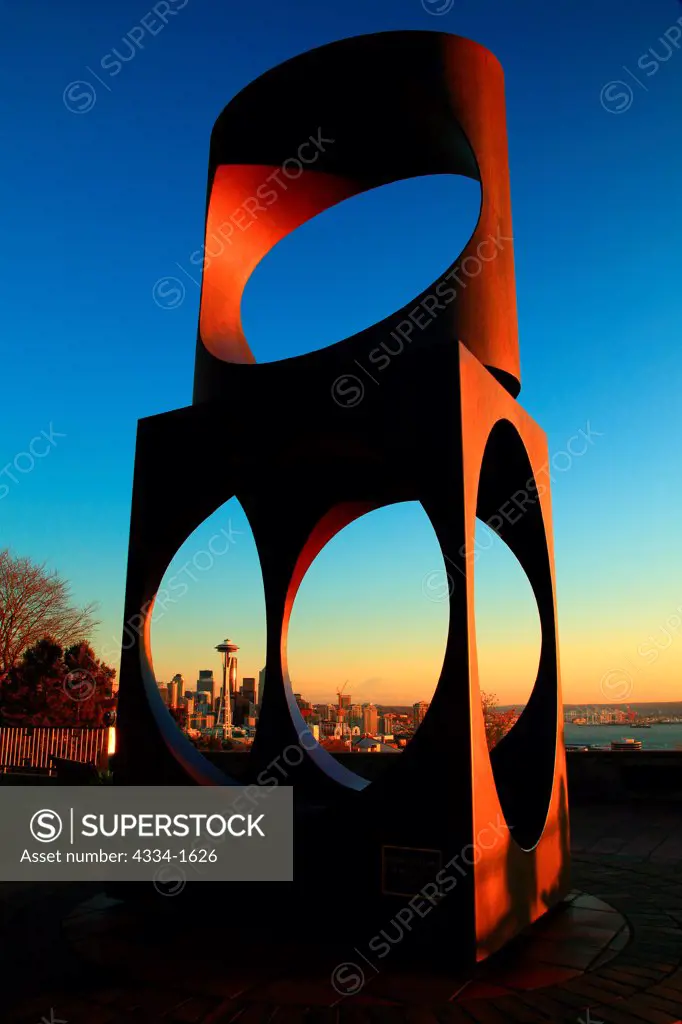 USA, Washington, Seattle, Skyline in afternoon light with Mt Rainier viewed through changing form art sculpture in Kerry Park on Queen Ann Hill