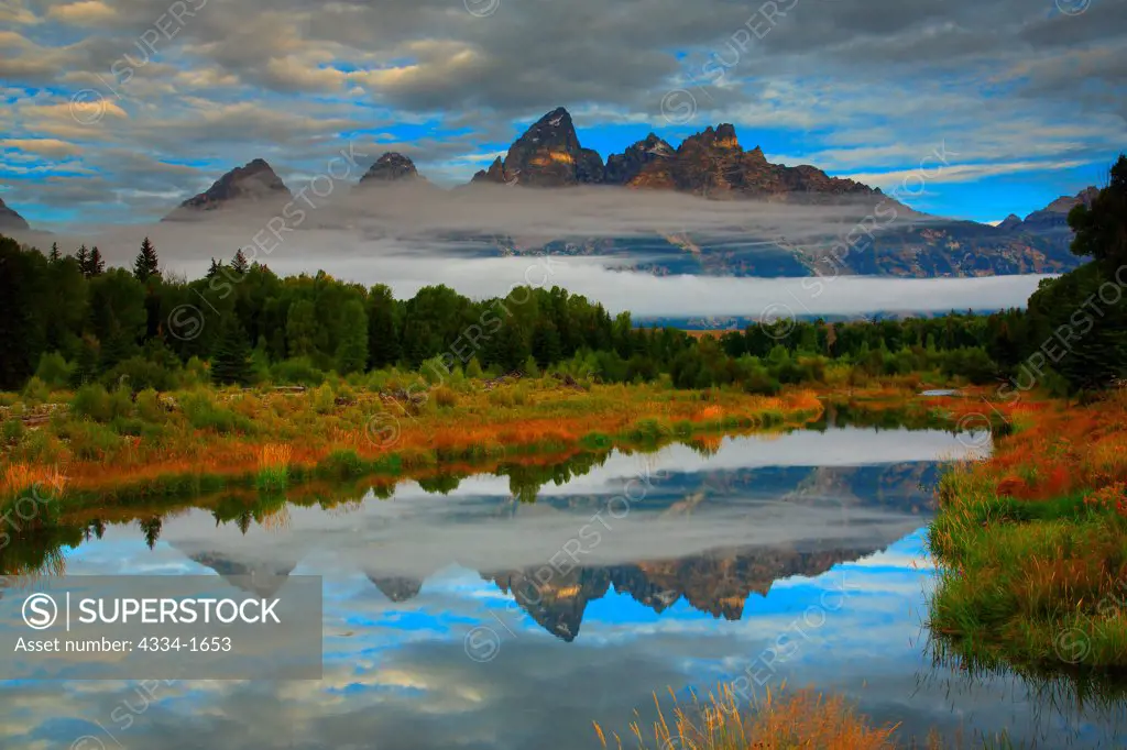 USA, Wyoming, Sunrise with Grand Tetons reflected in Beaver Pond on Snake River in Grand Teton National Park