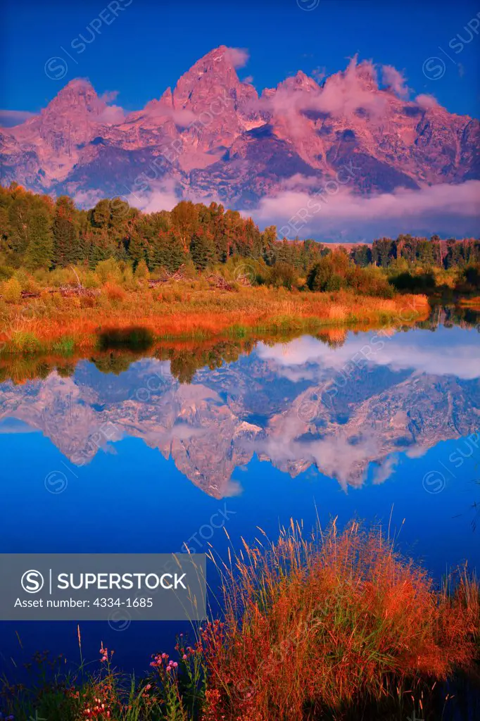 USA, Wyoming, Sunrise with Grand Tetons reflected in Beaver Ponds along Snake River in Grand Teton National Park