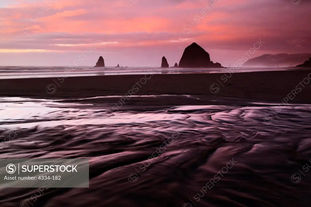 Sunset with Haystack Rock at Cannon Beach, Oregon.