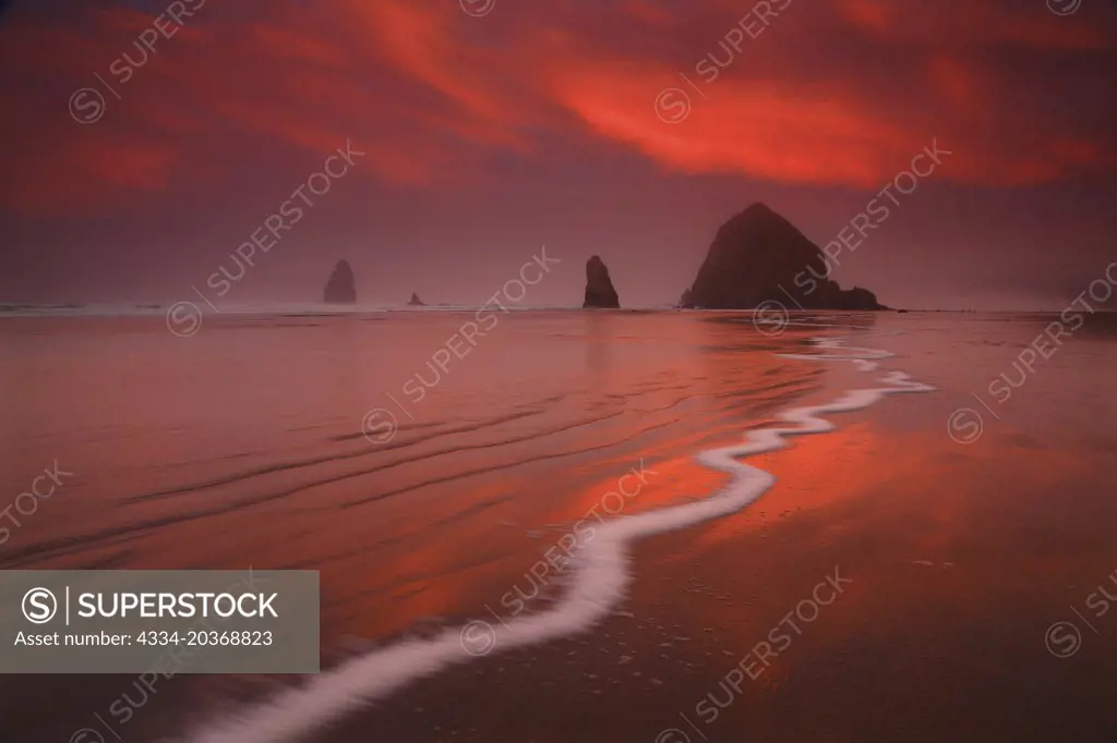 Crazy Sunrise Light Over Haystack Rock and The Needles From Cannon Beach in Oregon