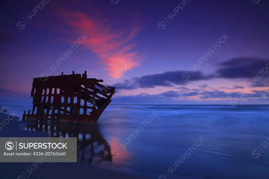 Sunset and the Peter Iredale Shipwreck on the Clatsop Spit Beach in Fort Stevens State Park on the Northern Oregon Coast