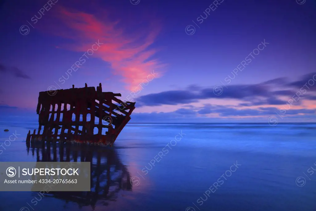 Sunset and the Peter Iredale Shipwreck on the Clatsop Spit Beach in Fort Stevens State Park on the Northern Oregon Coast