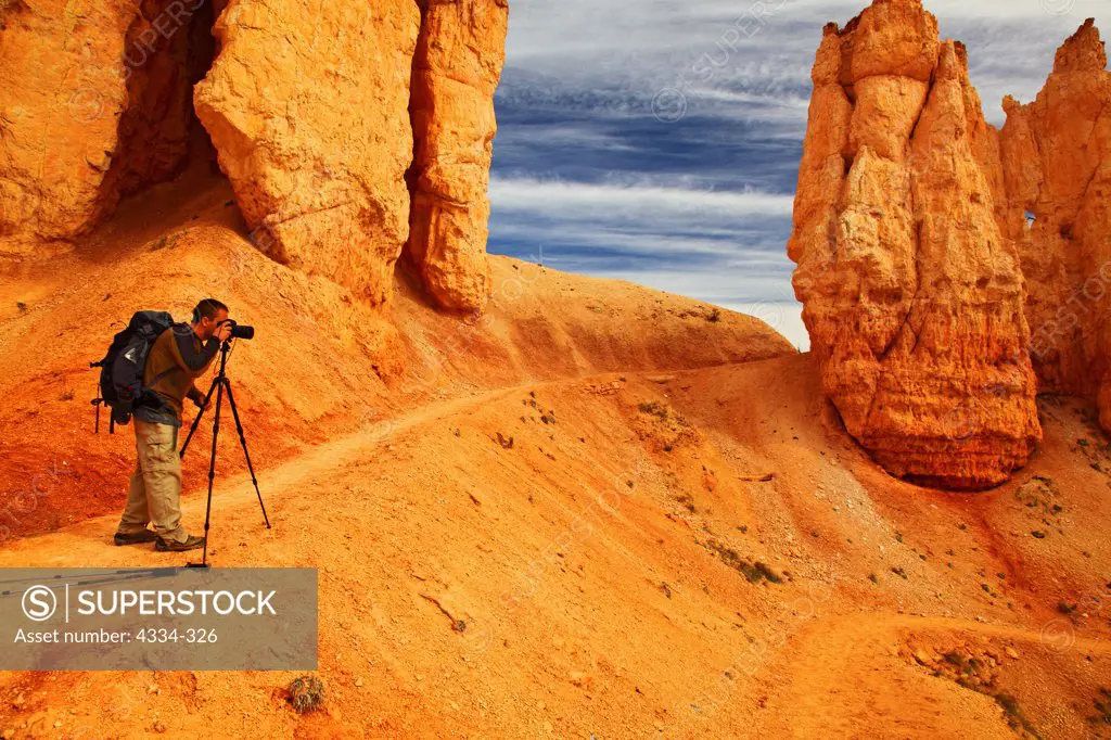 A photographer taking pictures in the Fairyland Loop in Bryce Canyon National Park, Utah.