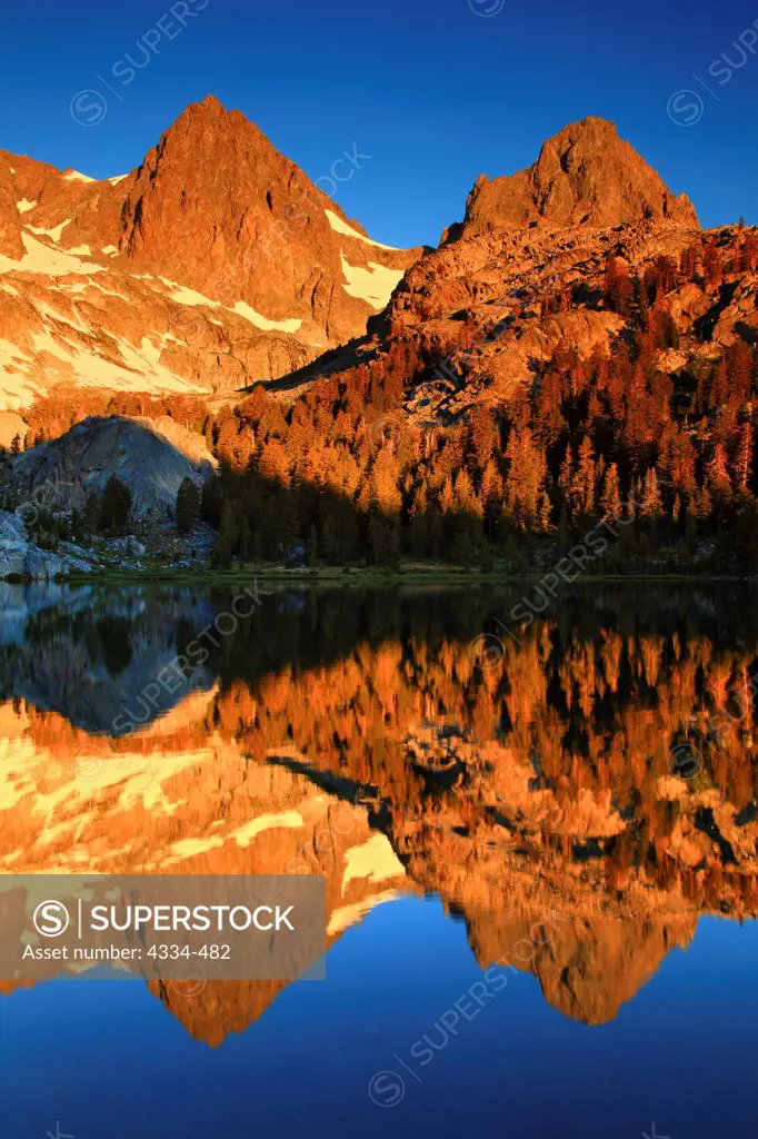 Sunrise with Mount Ritter and Banner Peak reflecting in Ediza Lake in the Ansel Adams Wilderness, California.