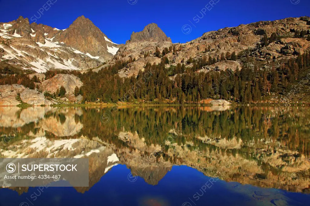 Banner Peak and Mount Ritter reflecting in Ediza Lake in the Ansel Adams Wilderness, California.
