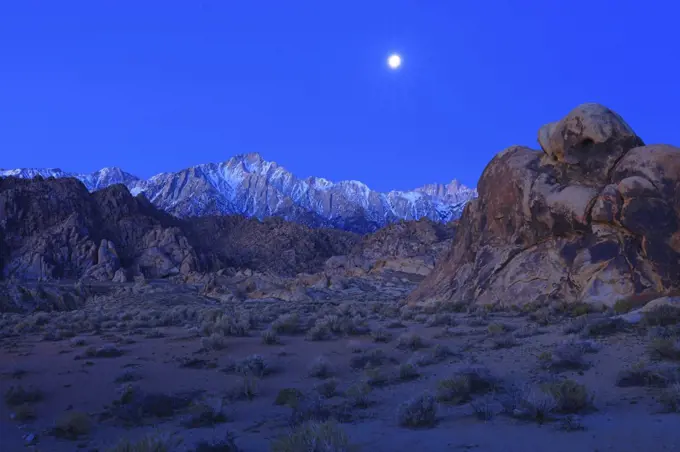 Moon Over Lonepine Peak over Rock Formations in Alabama Hills National Recreation Area in California