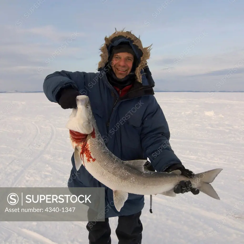 Man Holding a Large Sheefish