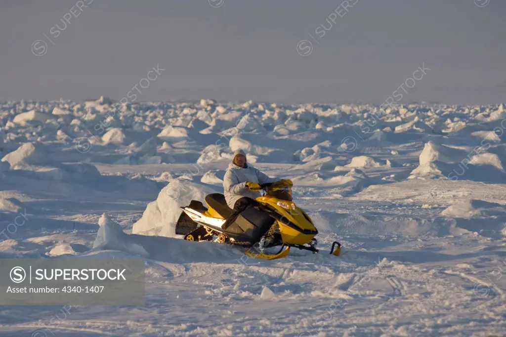 Inupiaq Whaler Traveling by Skidoo Over the Pack Ice, Chukchi Sea