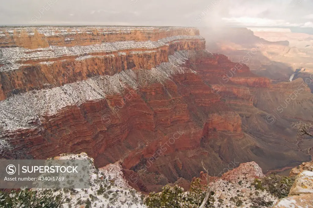 Scenic snowy winter landscape along the south rim of Grand Canyon National Park, Arizona.