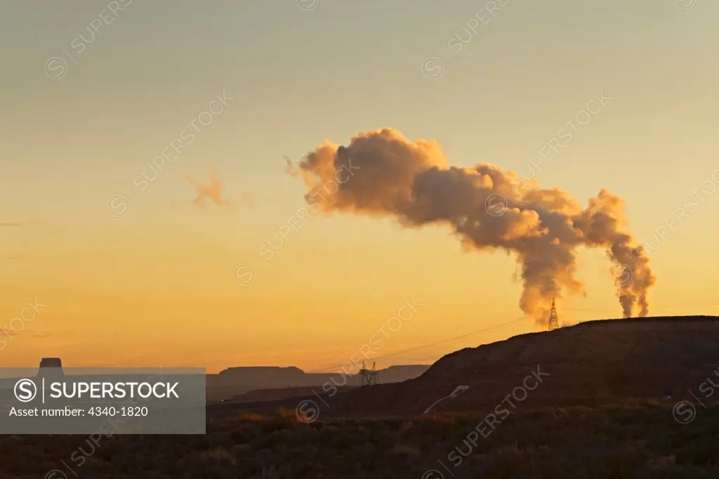 Air pollution smog from a coal fired power plant at sunrise, outside of Page, Arizona.  Coal fired power plants are required to help provide the ever increasing electricity needs for the metropolitan areas of the southwest. They have however had a significant impact on the air quality of the Colorado Plateau.