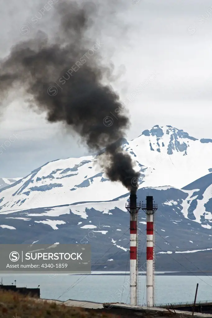 Smokestacks emit air pollution in the Russian coal mining settlement of Barentsburg, Spitsbergen, in summertime.