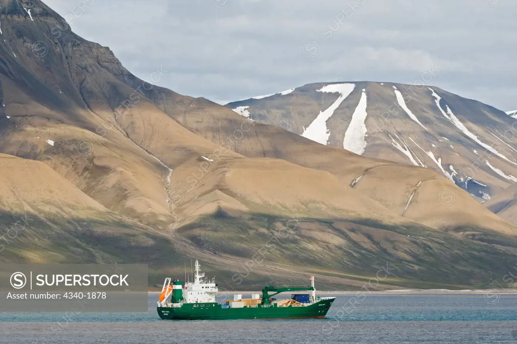 Cargo ship anchored in the harbor off Longyearbyen, Isfjorden, Svalbard, Norway, in summertime.