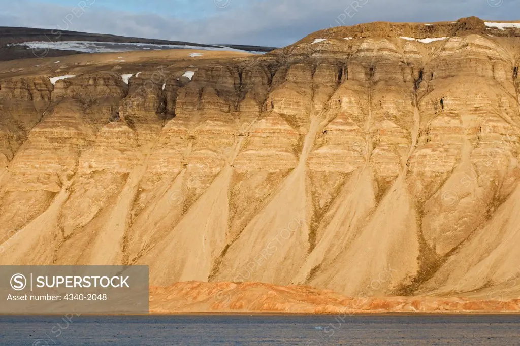 Rugged coastal landscape in Sassenfjorden, east of the settlement of Longyearbyen, Svalbard, Norway, in summertime.