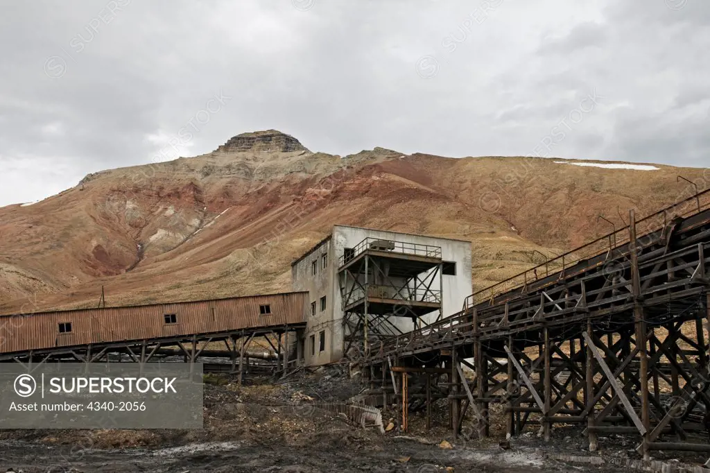 Coal mining facilities at Pyramiden - a former Russian coal mining settlement in Billefjorden, Spitsbegren, Norway.  It was founded by Sweden in 1910, and sold to the Soviet Union in 1927, then was abandoned January 10, 1998.  Pyramiden is currently being re-developed by the Russians, to accommodate tourists.