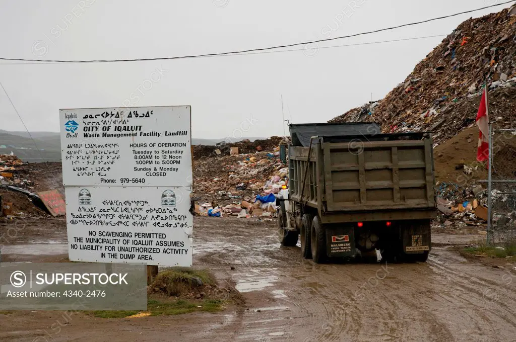 Garbage truck arrives at the local Waste Management facility in the city of Iqaluit, Nunavut Territory, Canada