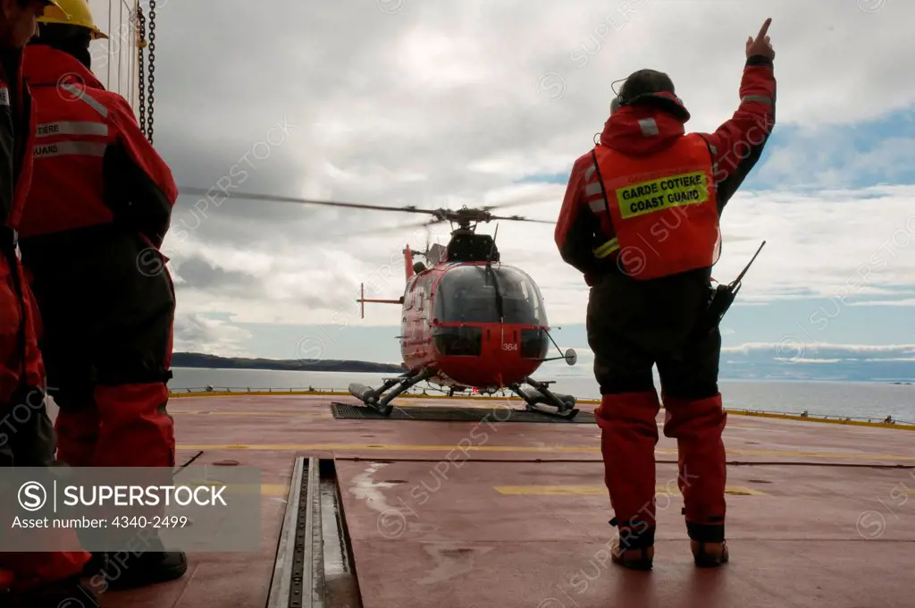 Canadian coast guard helicopter brings new crew members, researchers, and gear, aboard the CCGS Amundsen, a coast guard ship where scientific research is conducted, Iqualuit, Baffin Island, Nunavut, Canada