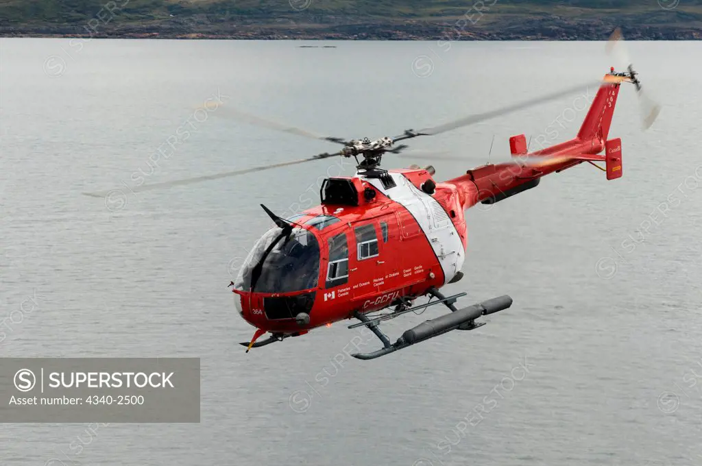 Canadian coast guard helicopter transporting crew members, researchers, and gear aboard the CCGS Amundsen, a coast guard ship where scientific research is conducted, Iqualuit, Nunavut Territory, Canada