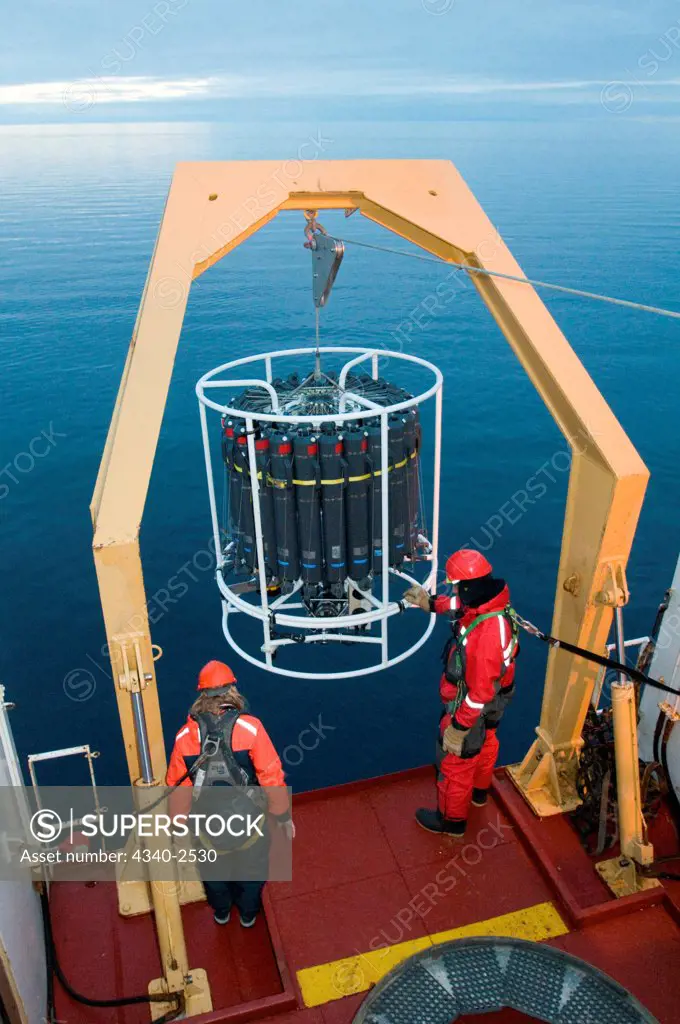 ArcticNet scientists deploy the CTD-Rosette sampler from the CGGS Amundsen, the rosette takes water samples from certain depths, Baffin Bay, Northwest Passage, Nunavut, Canada