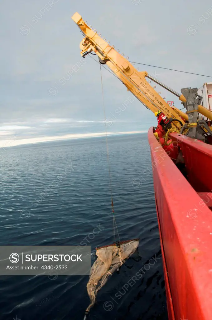 ArcticNet scientists sample juvenile fish using a Rectangular Mid-Water Trawl deployed from the foredeck of the CGGS Amundsen, Baffin Bay, Nunavut, Canada