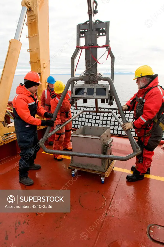 ArcticNet scientists prepare the box car, which takes sediment samples from sea floor, including benthic organisms and mud, aboard the CCGS Amundsen, Northwest Passage, Baffin Bay, Nunavut, Canada