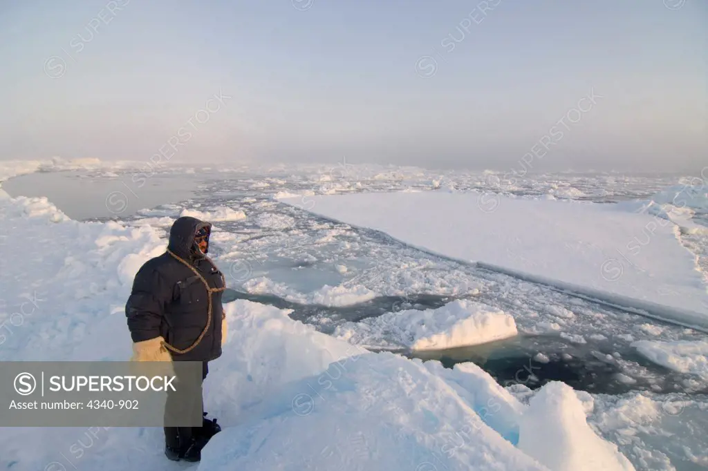 Inupiaq Whaler Surveys the Ice Conditions at the Edge of an Open Lead