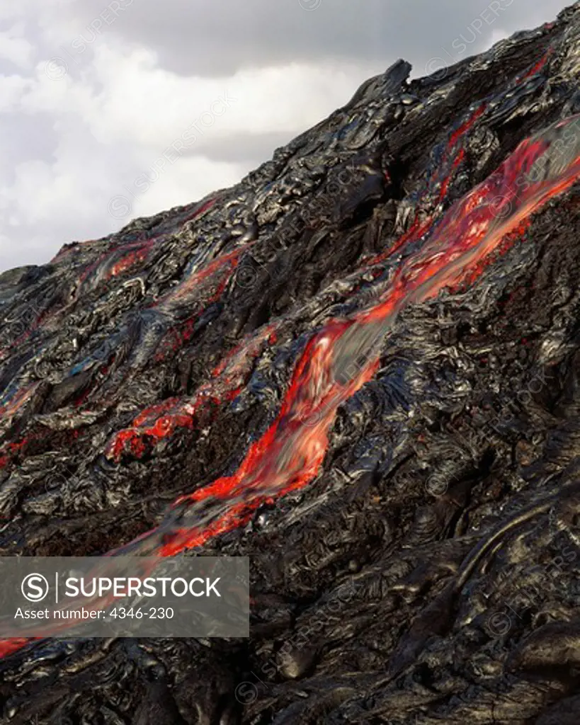 Hot Pahoehoe Lava Flows Relentlessly Downhill