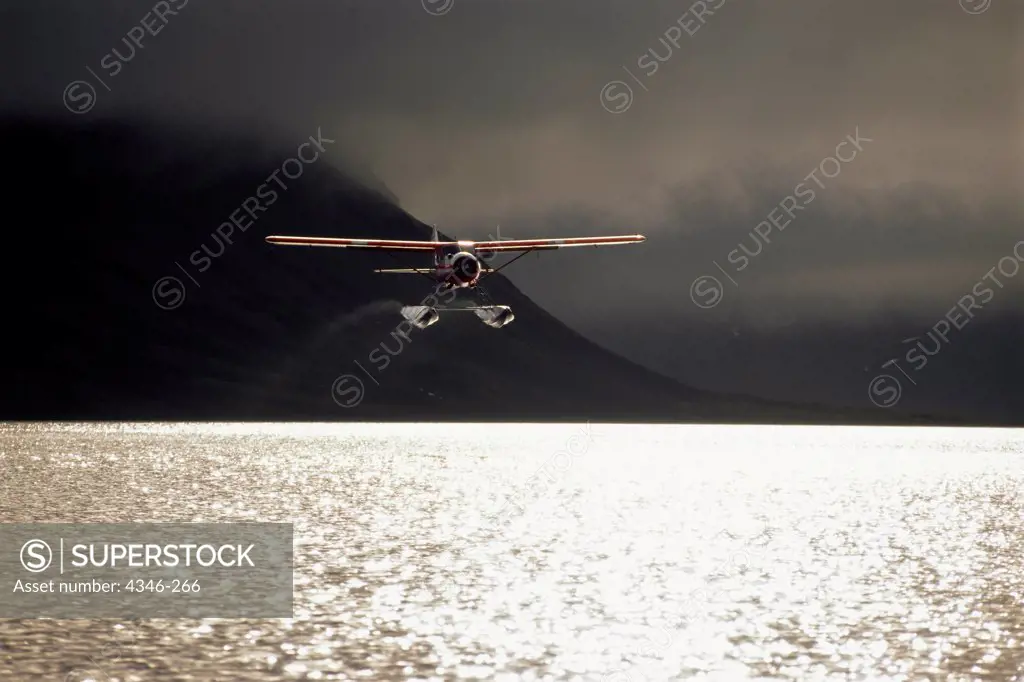 A Bush Plane Takes Off From a Remote Alaskan Lake