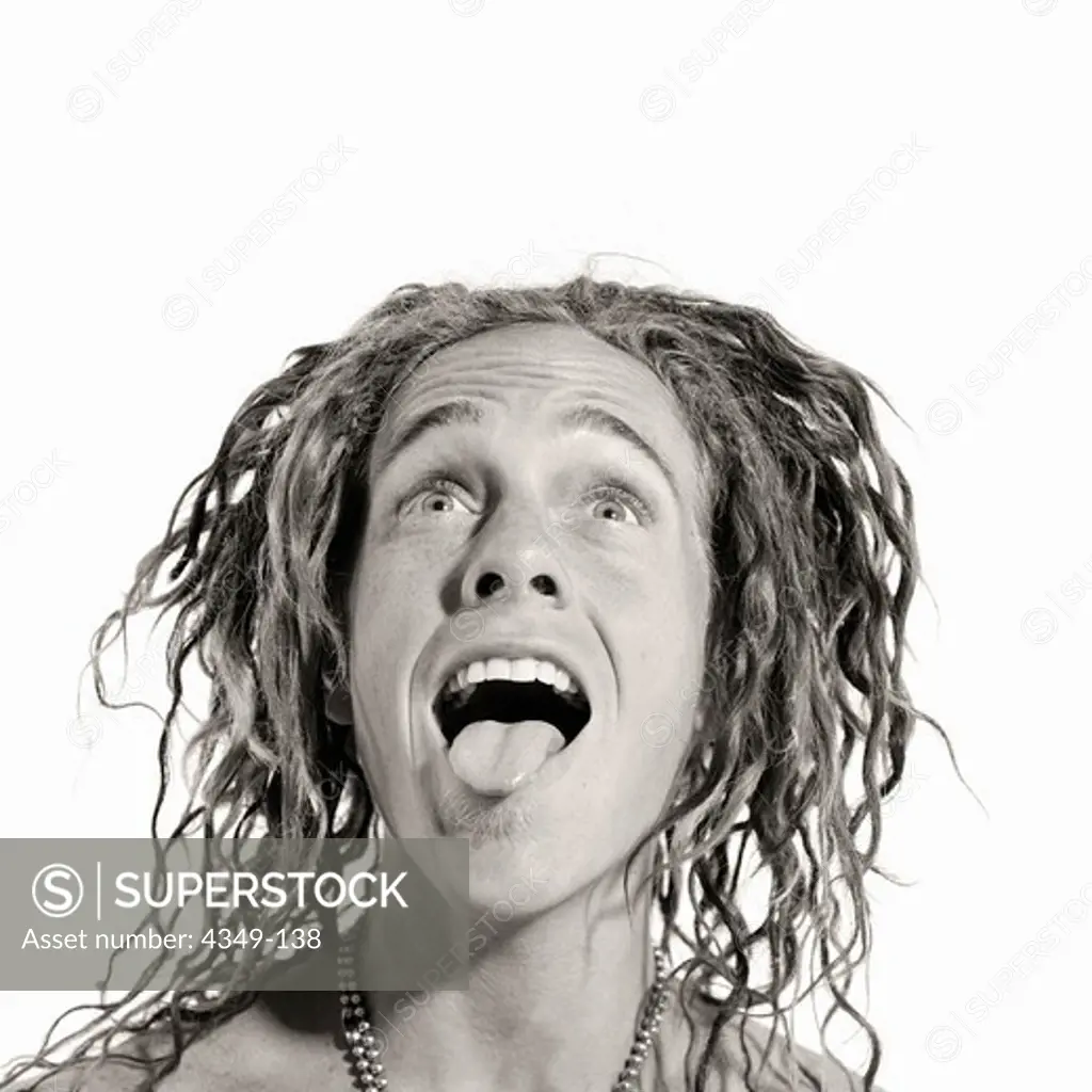 Dreadlocked Young Man with Tongue Out