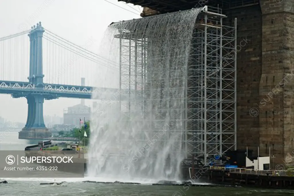 Artist Olafur Eliasson created a series of artificial waterfalls in and around Manhattan and New York harbor, like this one under the Brooklyn Bridge.