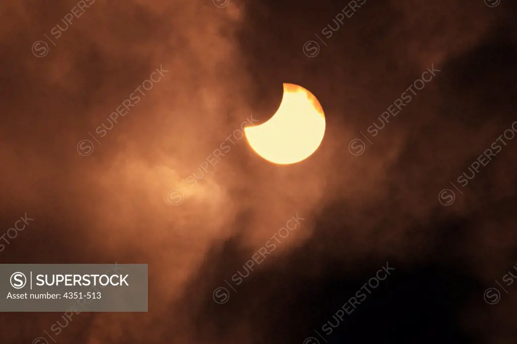 Clouds obscure a partial solar eclipse, seen from Givatayim Observatory in Tel Aviv.