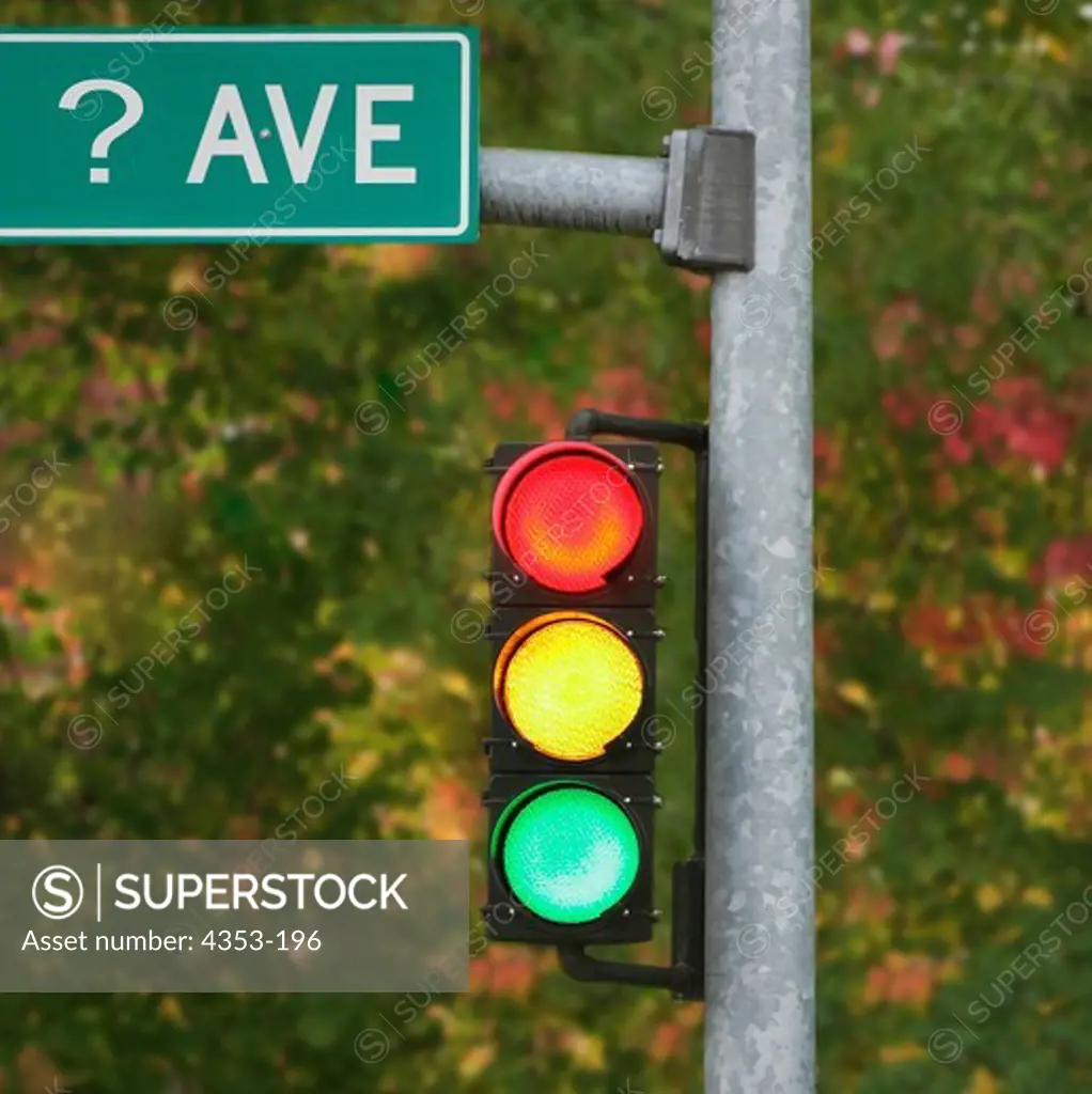 Traffic Light with All Lights On and Street Sign