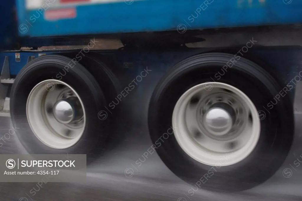 Speeding Truck Tires in Heavy Rain