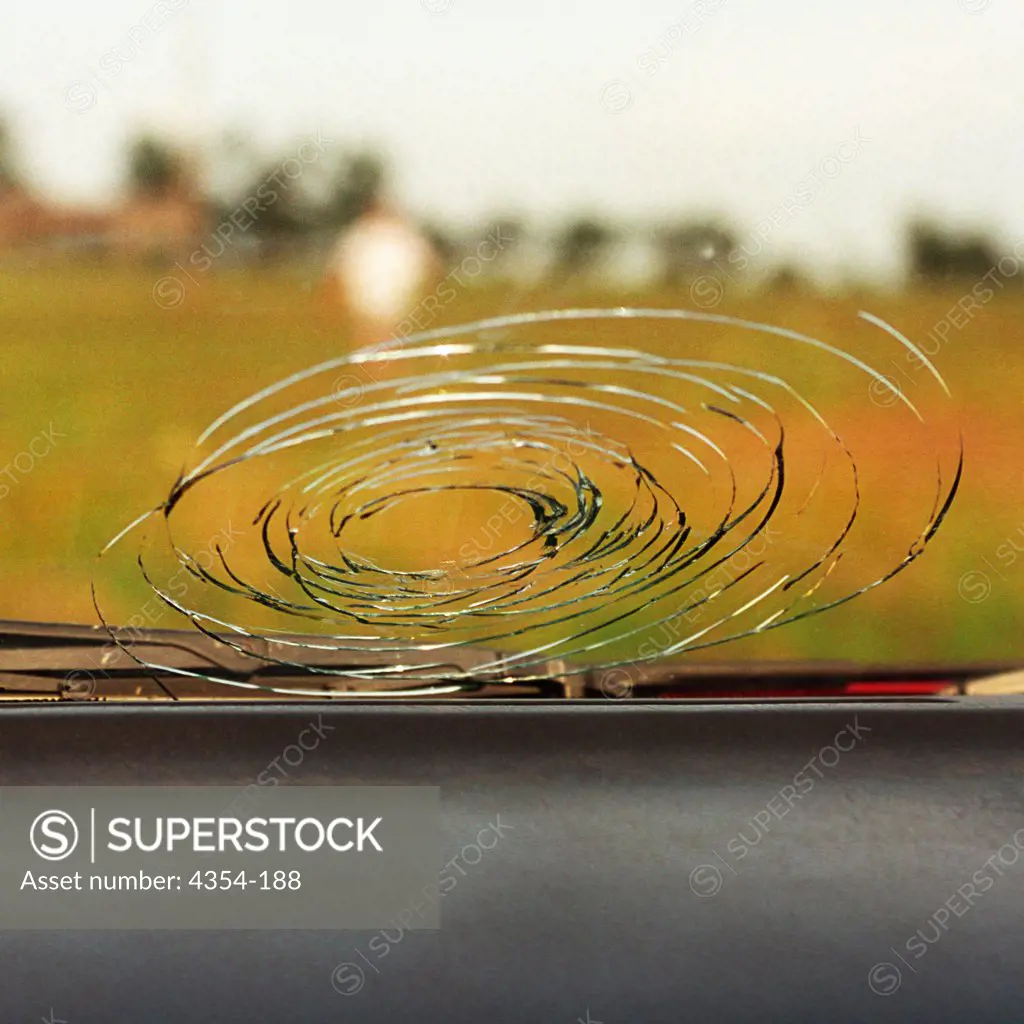 A Car Windshield Damaged by Hail