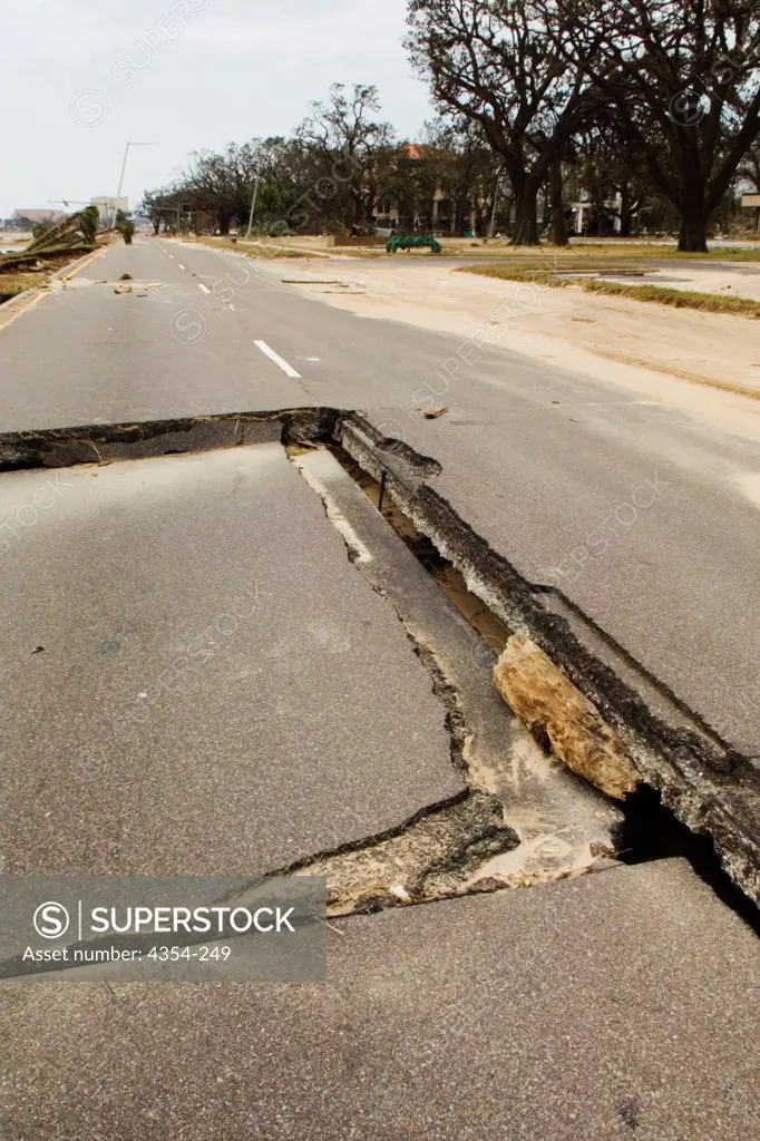 A Sinkhole Destroys a Section of Road After Katrina