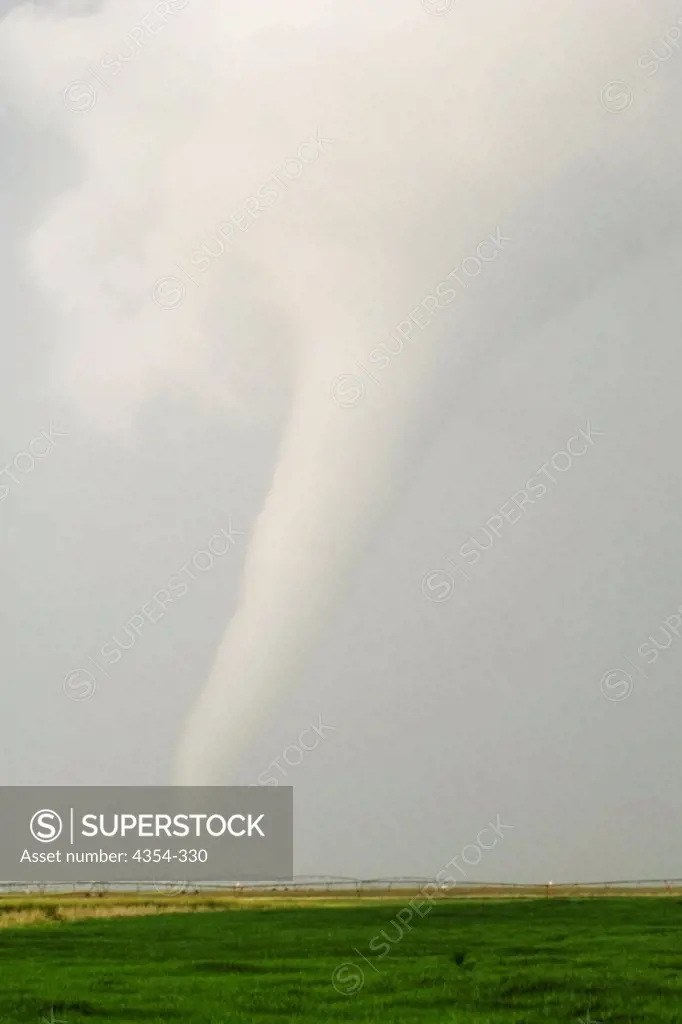 Milky White Tornado Spins Across Farmland