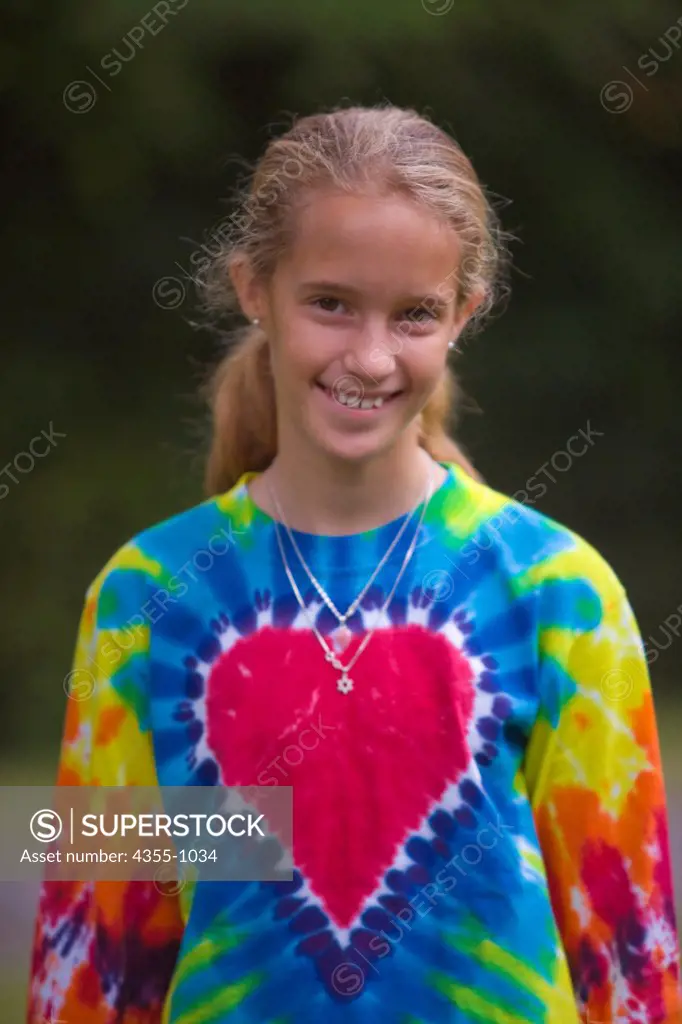 Smiling Girl in Tie-Dye Shirt