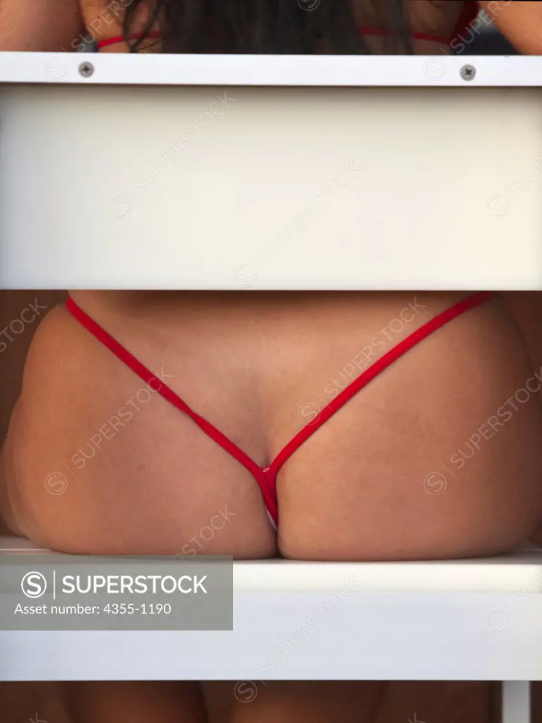 Rear End of Woman Wearing String Bikini