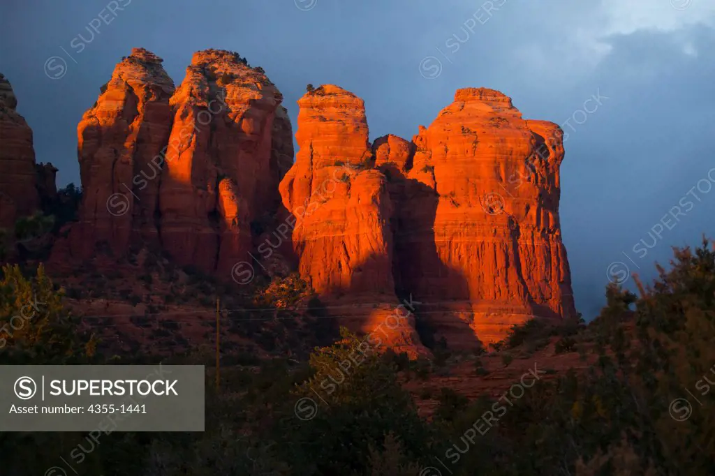 Sedona at sunset , Arizona. Sedona is a city and community that straddles the county line between Coconino and Yavapai Counties in the northern Verde Valley region of the U.S. state of Arizona. Sedona's main attraction is its stunning array of red sandstone formations, the Red Rocks of Sedona. The formations appear to glow in brilliant orange and red when illuminated by the rising or setting sun. The Red Rocks form a breathtaking backdrop for everything from spiritual pursuits to the hundreds of