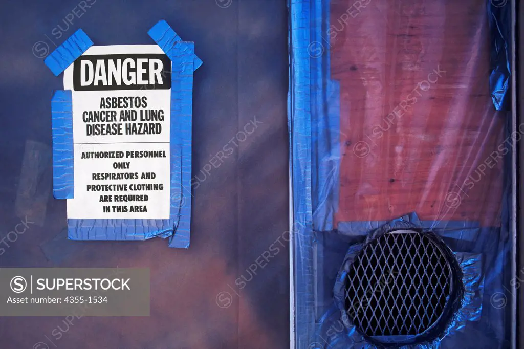 A warning sign on an asbestos contaminated building.