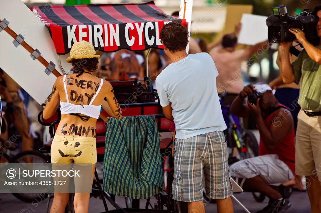 Participants and press at the Miami Naked Bicycle Race, an event to protest the Gulf of Mexico oil spill.